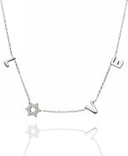 LOVE WITH A JEWISH STAR IN GOLD: The word LOVE is spelled out in warm yellow gold script letter charms where the letter O is replaced by a Star of David set with cubic zirconia, a clever and beautiful