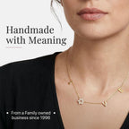 LOVE WITH A JEWISH STAR IN GOLD: The word LOVE is spelled out in warm yellow gold script letter charms where the letter O is replaced by a Star of David set with cubic zirconia, a clever and beautiful